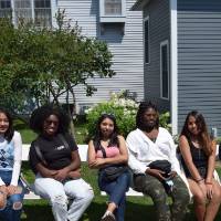 Photo of students with Program Advisor waiting for tour carriage